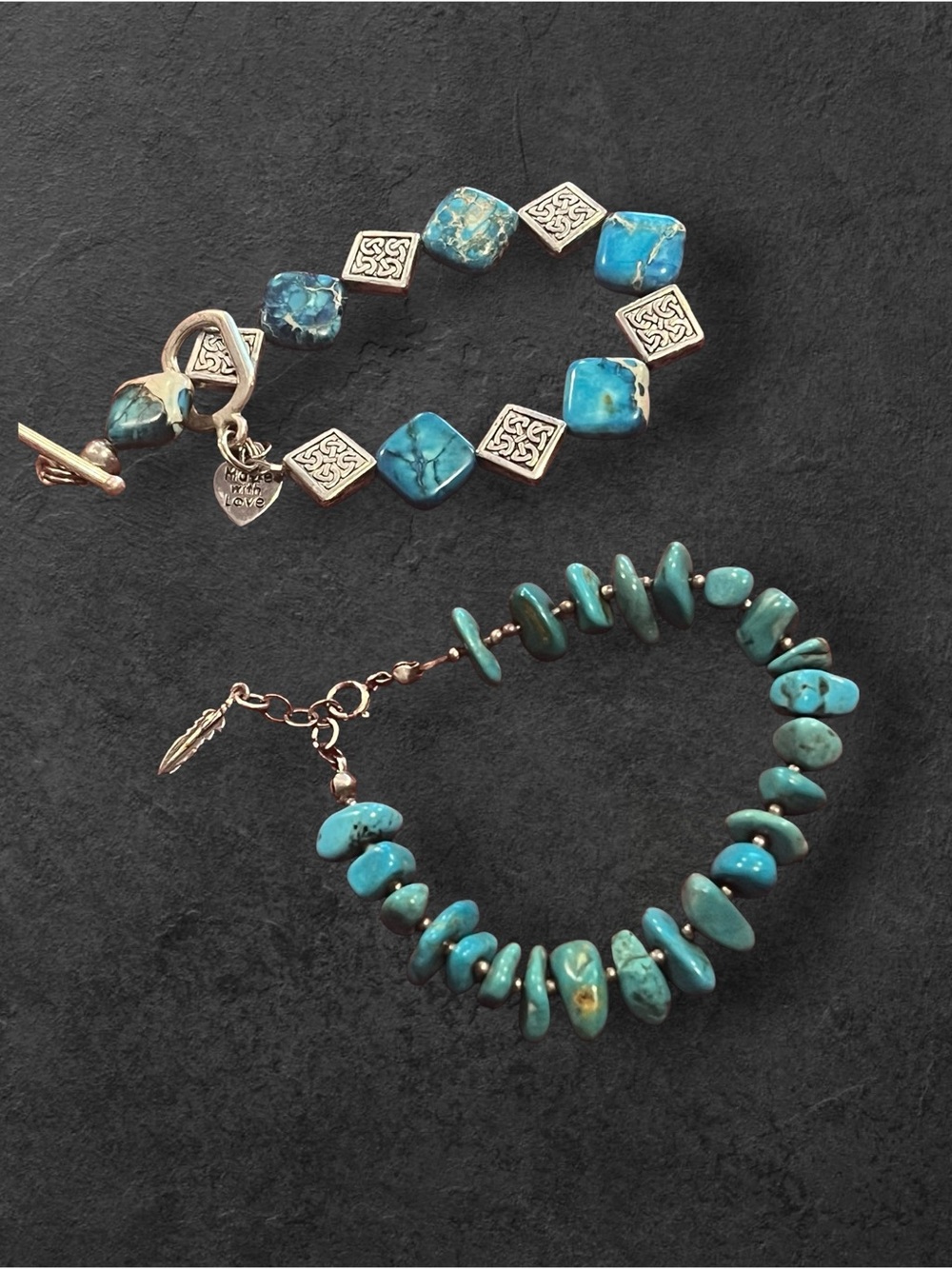 Two Turquoise and silver nugget style bracelets.